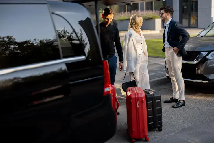 Travelers with luggage near Southend airport taxi
