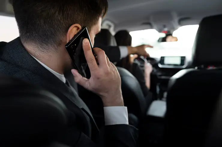 Business traveler in Luton airport taxi on phone call